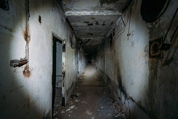 Dark creepy corridor in abandoned nuclear power plant in Crimea. First person view, going with...