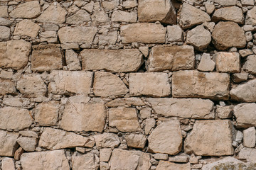 Old stone wall texture, blocks of ancient castle surface as background for design