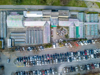 Aerial view of praking next to greenhouse