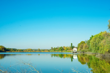 Fototapeta na wymiar Amazing landscape of lake with clear green water and Perfect blue sky. Ukraine