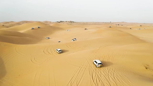 View From Above on off-road Cars Moving Through the Desert