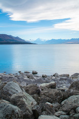Fototapeta na wymiar Scenic landscape panoramic view of the Lake Pukaki and Aoraki/Mount Cook on background. Tourist popular destination in South Island, New Zealand. Clear sky, sunny summer day. Travel concept.