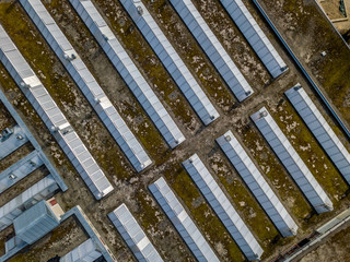 Aerial view of roof with windows on roof of industrial building 