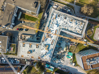 Aerial view of construction site in Switzerland with large yellow crane