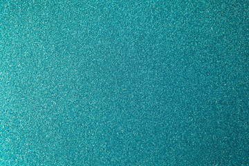 Metallic glitter green-blue aquamarine wrapping paper backgrond, close-up. Copy space for text. Horizontal and vertical. Celebration, holidays, sales, fashion concept, harvesting for mock up.