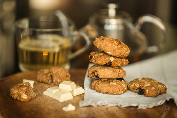oatmeal cookies with chocolate and tea