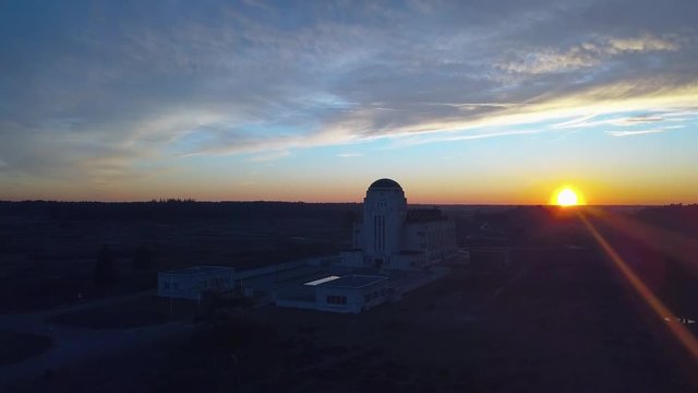 Ascending aerial shot, showing the abandoned Radio Kootwijk during sunset.