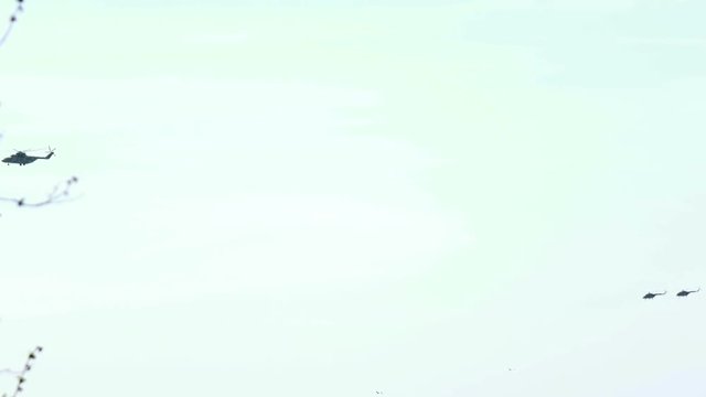 military helicopters return from a fighting task
