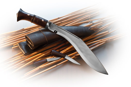 khukri knife and sheath on wooden background