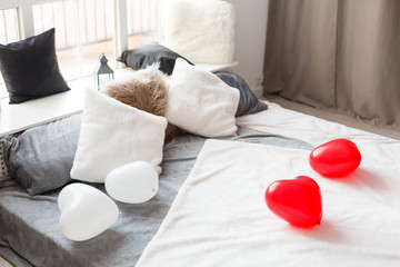 Grey king-size bed in monochromatic bedroom