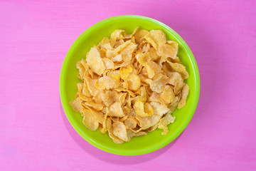 Corn flakes breakfast on colorful background