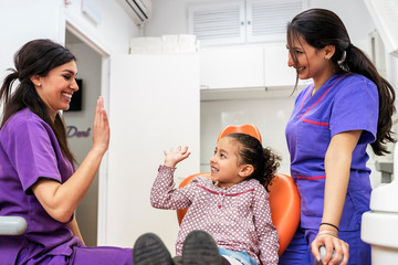 Dentist doctor and child patient having fun