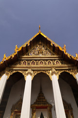 Naklejka premium Wat Phra Kaew, commonly known in English as the Temple of the Emerald Buddha or grand palace is regarded as the most sacred Buddhist temple in Thailand