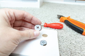 Hand holding fitting, fixing or fastener for mounting assembling furniture made of chipboard
