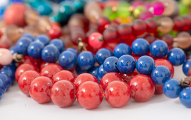 Mixed colors beads close-up made from natural stones or glass marbles