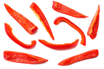 cut slices of red sweet bell pepper isolated on white background top view