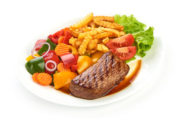 Roasted barbecue medium rare beef steak with french fries and vegetables, fried meat, close-up. isolated on white background
