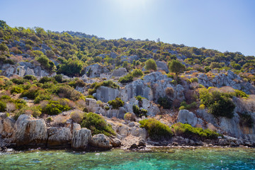 Sunken ruins in Kekova island of Dolichiste ancient Lycian town facing Kaleköy-ancient Simena destroyed by an earthquake in AD.141-rebuilt and lasting until the Byzantine era. Antalya - Turkey.