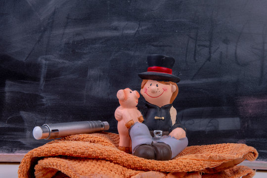 small chimney sweep with chalk and blackboard - luck at school