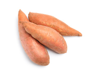 Whole ripe sweet potatoes on white background, top view