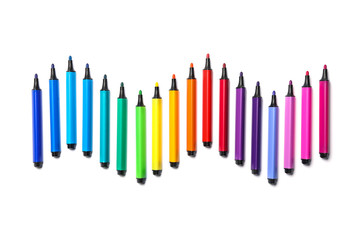 Many colorful markers on white background, top view. Rainbow palette