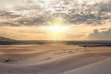 Fototapeta na wymiar Sunset in red dunes, Phan Thiet, Vietnam