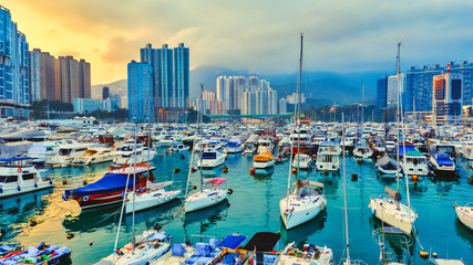 Panoramic view from above of Small fishing boats near the wave barrier in aberdeen Typhoon Shelters Hong Kong