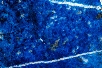 Macro of mineral stone Lazurite on a black background