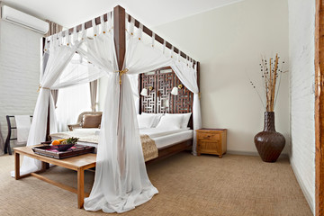 Luxurious modern bedroom interior with canopy bed