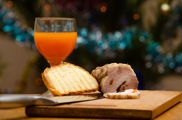 Still-life with baked ham, bread toast and juice