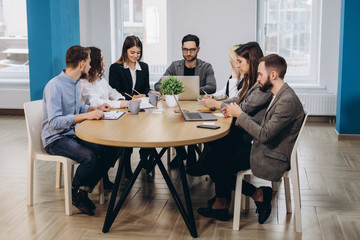 Full concentration at work. Corporate team working colleagues working in modern office