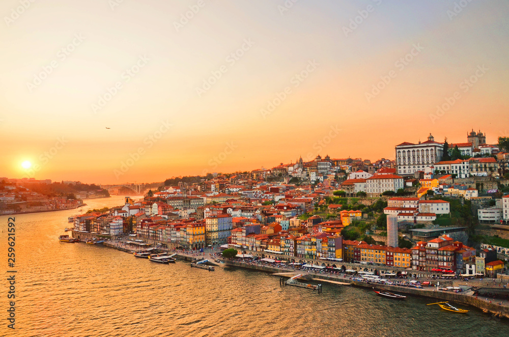 Wall mural Magnificent sunset over the Porto city center and the Douro river, Portugal. Dom Luis I Bridge is a popular tourist spot as it offers such a beautiful view over the area.