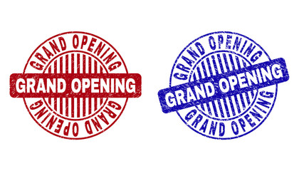 Grunge GRAND OPENING round stamp seals isolated on a white background. Round seals with distress texture in red and blue colors.