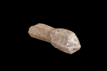 Macro of a stone, a scepter-like quartz mineral on a black background