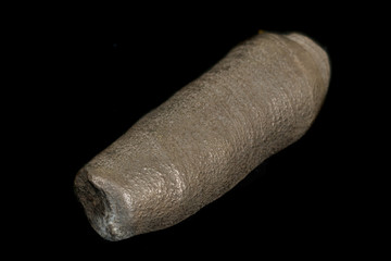 Macro mineral pyrite stone on a black background