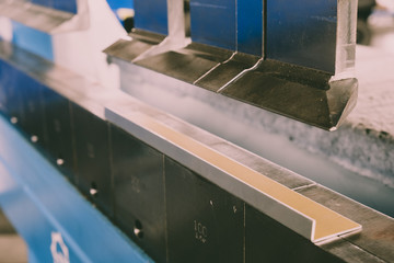 Sheet metal bending machine in the production plant	