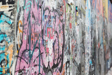Close-up of graffiti at the East Side Gallery, section of the Berlin Wall in Berlin, Germany.
