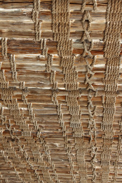 Roof made of wood and rope woven together background image 