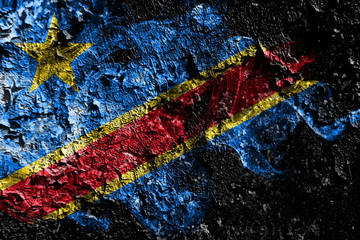 Democratic Republic of the Congo smoky mystical flag on the old dirty wall background