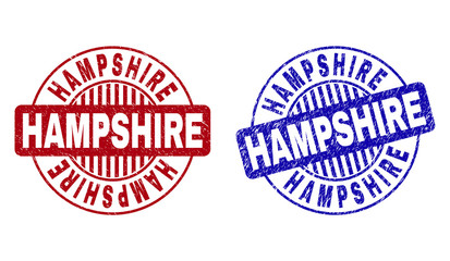 Grunge HAMPSHIRE round stamp seals isolated on a white background. Round seals with grunge texture in red and blue colors. Vector rubber overlay of HAMPSHIRE label inside circle form with stripes.