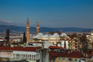 Fototapeta na wymiar Panoramic view of historical part of Bursa, Ulu mosque and Ulu mountain on background