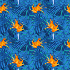 Vector seamless pattern with tropical flowers. Floral background in trendy fantasy colors. Texture with bright blue monstera leaves, foliage, birds of paradise flower, strelitzia. Exotic summer style