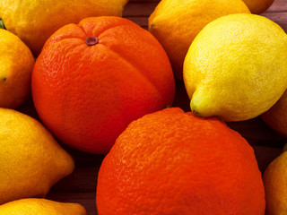 Lemons and oranges on the wooden table