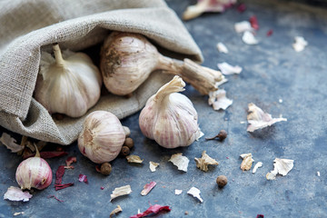 Garlic among husk and pepper peas