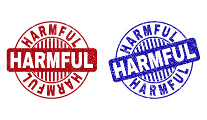 Grunge HARMFUL round stamp seals isolated on a white background. Round seals with distress texture in red and blue colors. Vector rubber imitation of HARMFUL tag inside circle form with stripes.