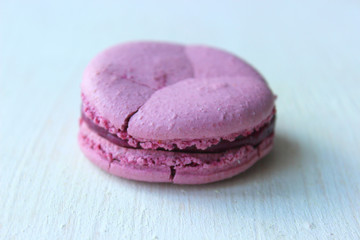 Colorful French or Italian macaroon stack cakes / Macaroon cakes. Assorted macaroon cakes stacked on top of each other on a light background. Copy space. Delicious dessert.