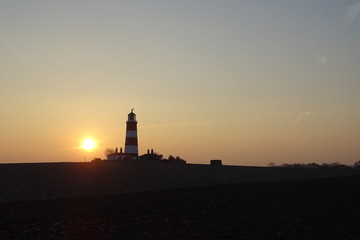 Fototapeta na wymiar Sunset views of Happisburgh Lighthouse - Norfolk, England, UK