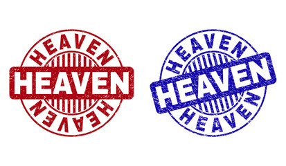 Grunge HEAVEN round stamp seals isolated on a white background. Round seals with distress texture in red and blue colors. Vector rubber imitation of HEAVEN caption inside circle form with stripes.