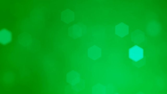 Abstract soft blurred hexagonal bokeh lights background animation. 4k Resolution, Glowing Warm Color Light Particles.