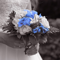 Beautiful wedding bouquet in monochrome with blue flowers